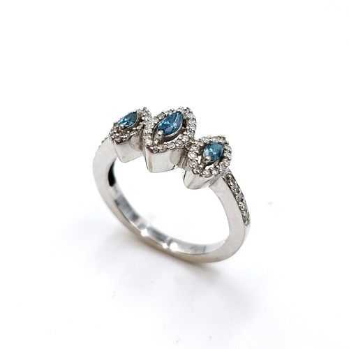 1354 - An outstanding 18 carat white gold marquis shaped blue and white brilliant cut diamond triple cluste... 