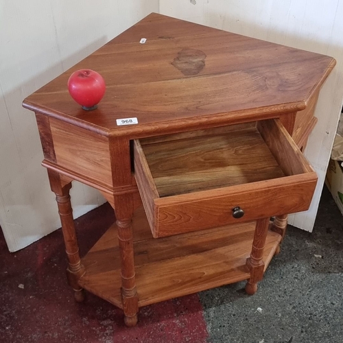 1413 - Corner wooden side table with single drawer and lower shelf. It is solidly constructed with turned l... 