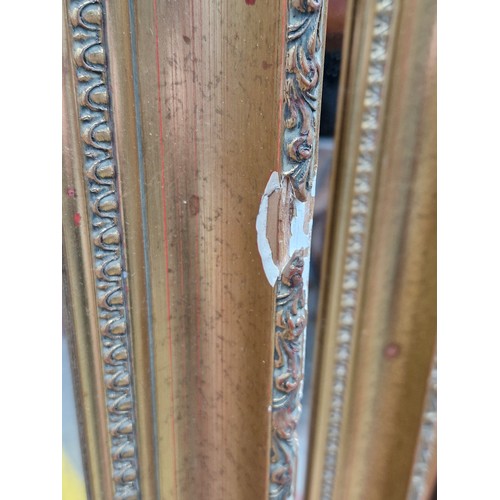 457 - A lovely pair of bevelled mirrors housed in a gilt frame. Approx. Dimensions - 40cm x 135cm & 47cm x... 