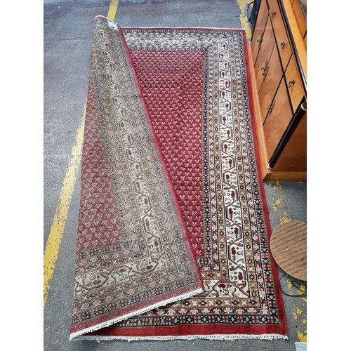 944 - Super Star Lot : A lovely hand knotted, hand made, Persian rug in geometric patterns in tones of red... 