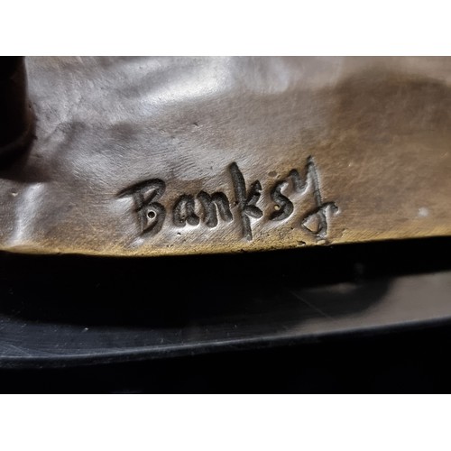 268 - Star Lot : A heavy bronze sculpture. Features 'Banksy Flower Thrower'. Mounted on marble. Initialed ... 