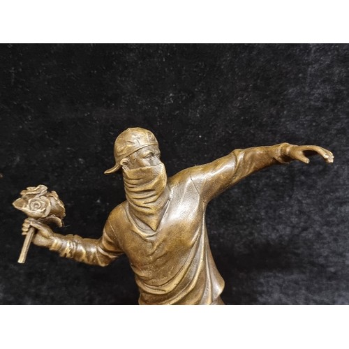 268 - Star Lot : A heavy bronze sculpture. Features 'Banksy Flower Thrower'. Mounted on marble. Initialed ... 