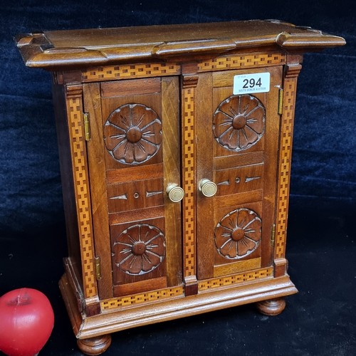 294 - A fabulous vintage counter / table top wooden cabinet featuring two doors to front opening to reveal... 