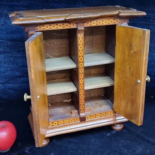 294 - A fabulous vintage counter / table top wooden cabinet featuring two doors to front opening to reveal... 