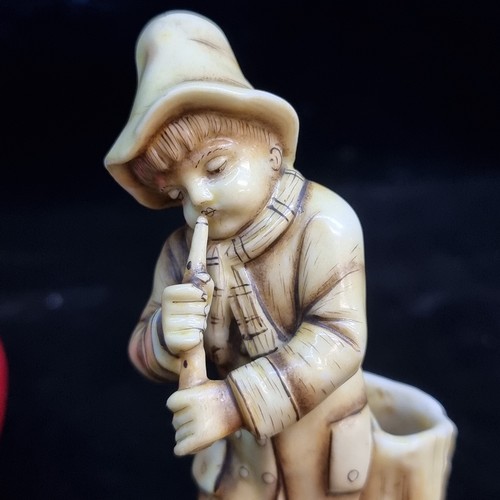 303 - A rather sweet antique porcelain figure of young male playing a flute, by Ernst Bohne Söhne highly d... 