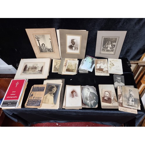 343 - A wonderful large mixed selection of both antique photographs and postcards of both an Irish and Uk ... 