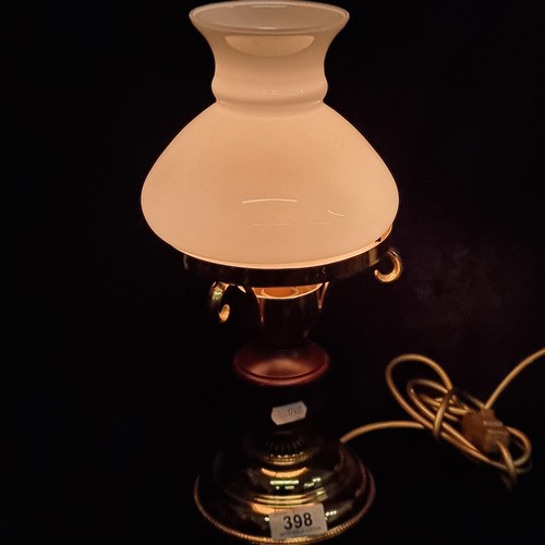 398 - A vintage brass, turned wood and milk glass table lamp. Damage to shade