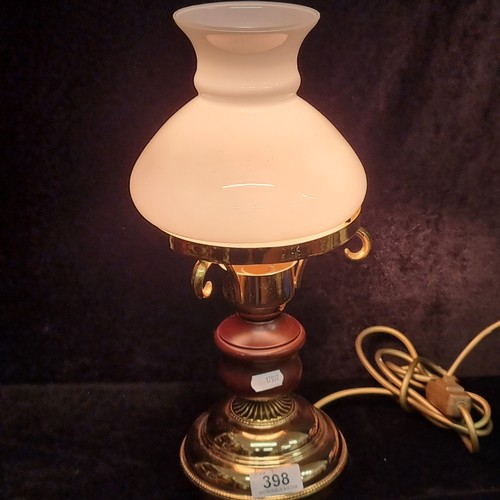 398 - A vintage brass, turned wood and milk glass table lamp. Damage to shade