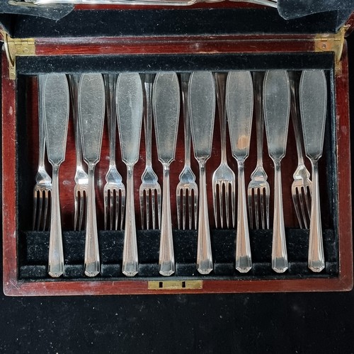 1158 - A wonderful early 20th century fish  cutlery canteen housed in a mahogany presentation case which fe... 