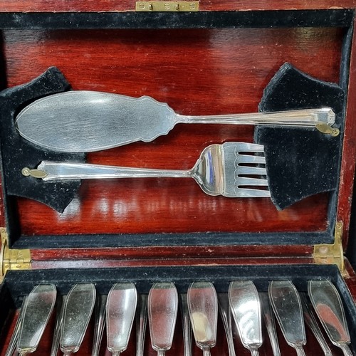 1158 - A wonderful early 20th century fish  cutlery canteen housed in a mahogany presentation case which fe... 