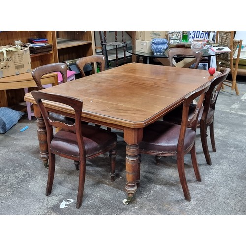 929 - A fabulous antique 19th century mohogany rectangular dining table with rounded edges and six chairs.... 