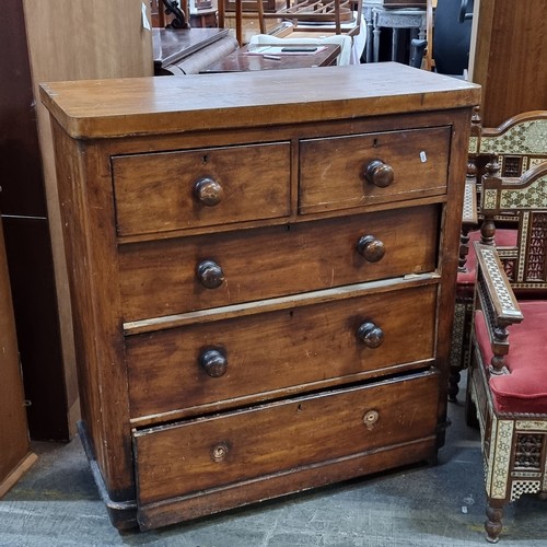 811 - An antique chest of drawers with five drawers with turned wood handles, missing two.