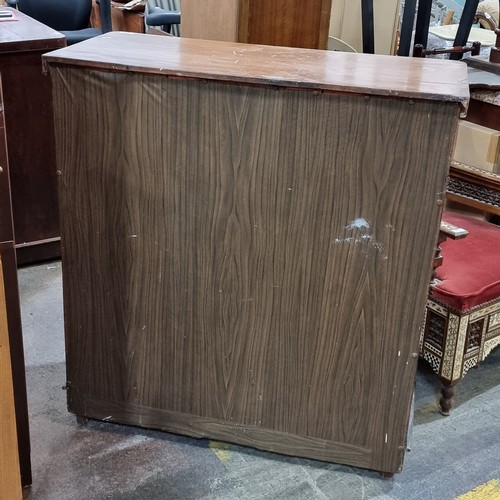 811 - An antique chest of drawers with five drawers with turned wood handles, missing two.