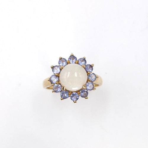 4 - Star Lot : A very pretty nine carat gold hallmarked opal central stone ring with amethyst petals.  S... 