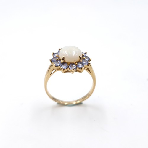 4 - Star Lot : A very pretty nine carat gold hallmarked opal central stone ring with amethyst petals.  S... 