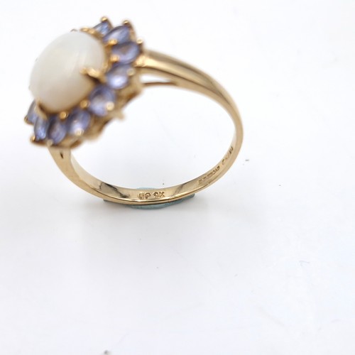 4 - Star Lot : A very pretty nine carat gold hallmarked opal central stone ring with amethyst petals.  S... 