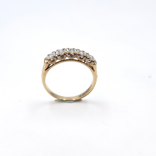 6 - Star Lot : A very bright five stone diamond ring set in nine carat gold (375). Est total weight of d... 