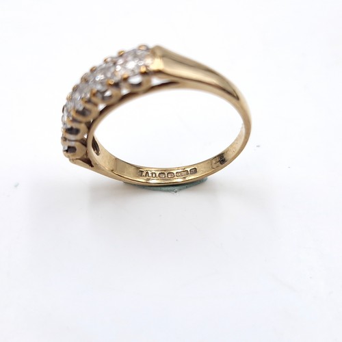 6 - Star Lot : A very bright five stone diamond ring set in nine carat gold (375). Est total weight of d... 