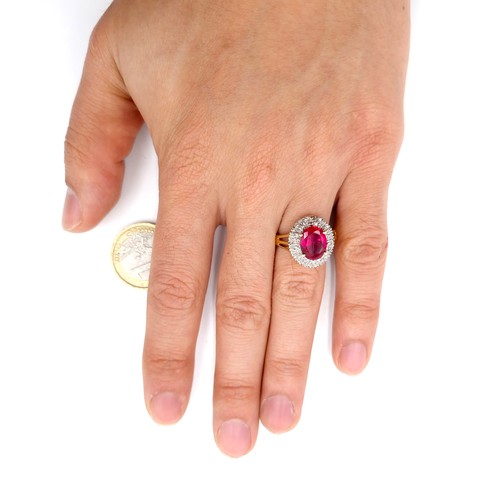 29 - Star Lot : A fabulous example of a central ruby stone ring with diamond cluster mount set in silver ... 