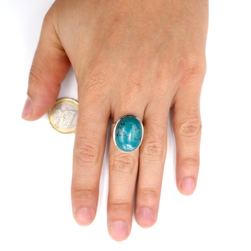 31 - A fabulous heavy turquoise stone ring mounted in sterling silver. Ring size - N. Weight - 10.55 gram... 