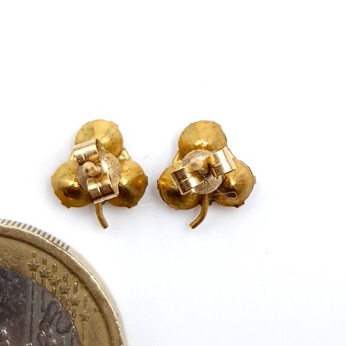 40 - A pair of nine carat gold gem set shamrock designed stud earrings. Total weight - 0.70 grams.