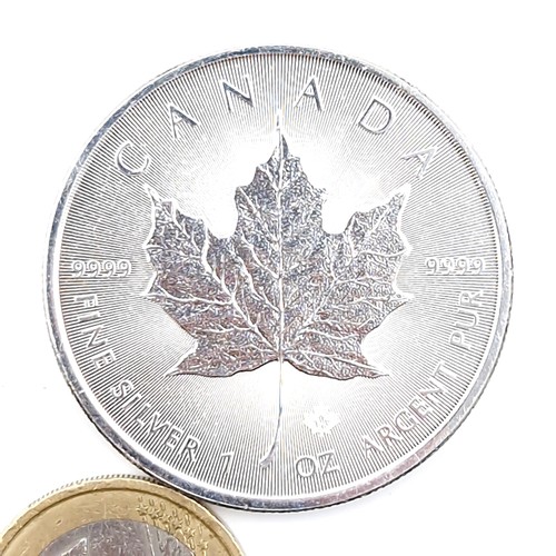 68 - A 0.9999 encapsulated QEII Canadian one ounce silver coin. Silver content - 99% proof.