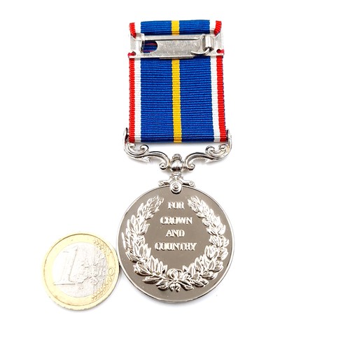 71 - A boxed UK national service medal no. 69303 with original box.