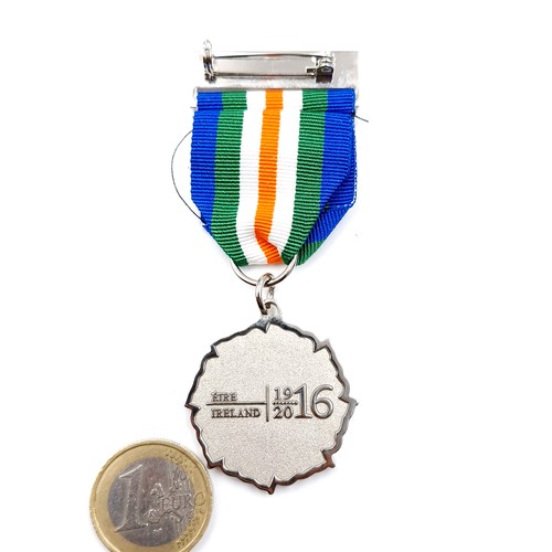 76 - An Irish 1916 commemorative medal and ribbon.