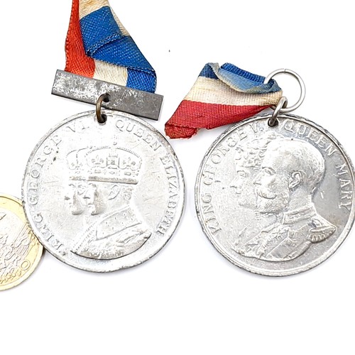 80 - Two medals - A King George V & Queen Mary silver jubilee medal together with a King George & Queen E... 