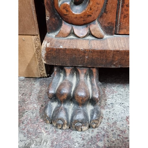 815 - Star lot : An Irish mid 19th century antique elaborate sideboard with lion paw feet, one pull out dr... 