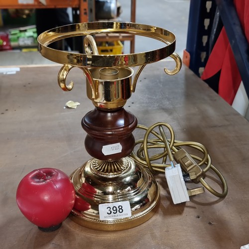 398 - A vintage brass, turned wood and milk glass table lamp. Damage to shade