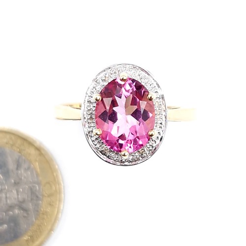 116 - Star Lot : A nine carat gold pink topaz & diamond stone ring. Size - U. Weight - 3.4 grams.