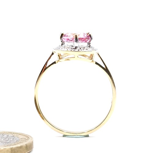 116 - Star Lot : A nine carat gold pink topaz & diamond stone ring. Size - U. Weight - 3.4 grams.