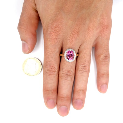 116 - Star Lot : A nine carat gold pink topaz & diamond stone ring. Size - U. Weight - 3.4 grams.