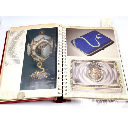 127 - A fully furnished photograph album depicting depicting Faberge jewellery items.