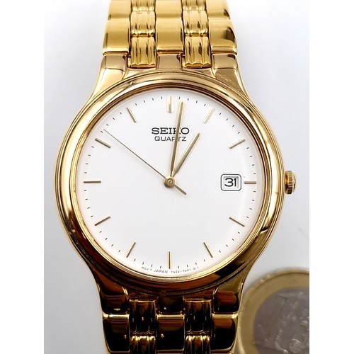 128 - A nice example of a Seiko quartz calendar gold plated wristwatch and bracelet. Watch with enamel fac... 