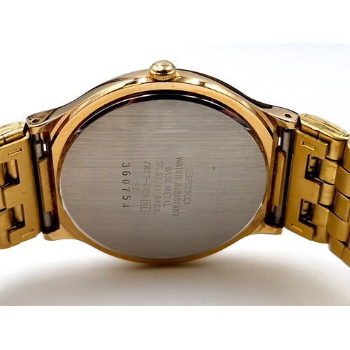 128 - A nice example of a Seiko quartz calendar gold plated wristwatch and bracelet. Watch with enamel fac... 