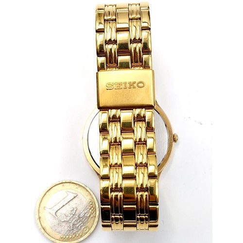 128 - A nice example of a Seiko quartz calendar gold plated wristwatch and bracelet. Watch with enamel fac... 