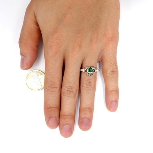 137 - A sterling silver green gemstone claddagh ring inscribed 'Love, Loyalty & Friends'. Size - M. Weight... 