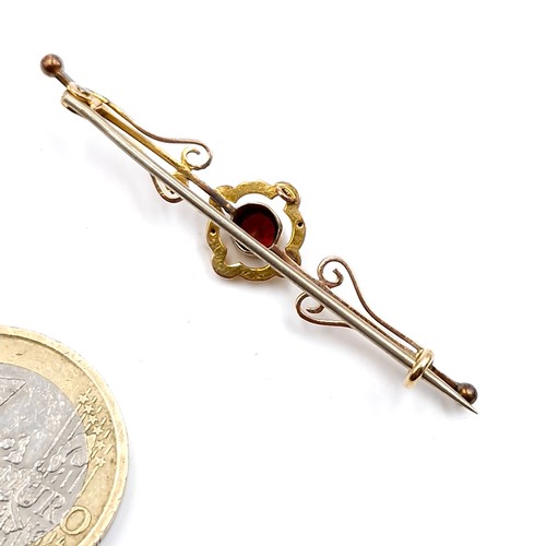 172 - An antique nine carat gold garnet stone brooch. Weight - 1.84 grams. Pin intact. Boxed.