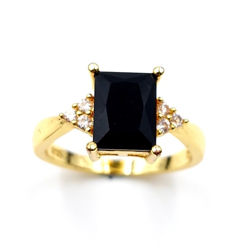 191 - A silver gilt onyx stone ring with gem set accents. Ring size - P. Weight - 2.78 grams. Boxed.