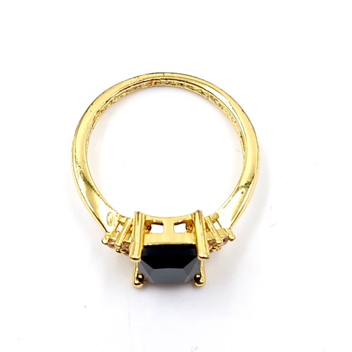 191 - A silver gilt onyx stone ring with gem set accents. Ring size - P. Weight - 2.78 grams. Boxed.