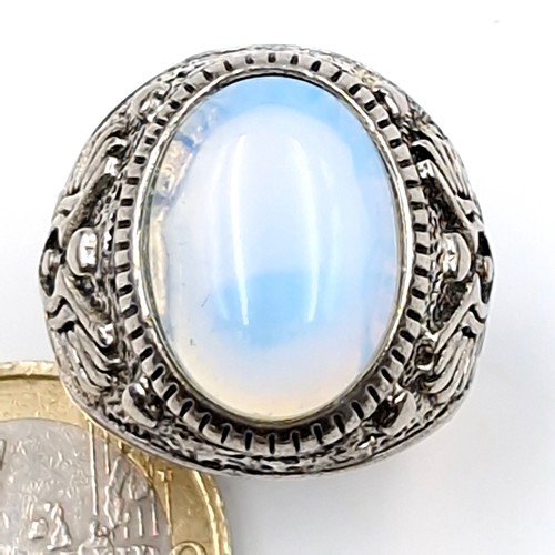 193 - A vintage College style moonstone silver mounted ring. Size - T. Weight - 9.4 grams. Boxed.