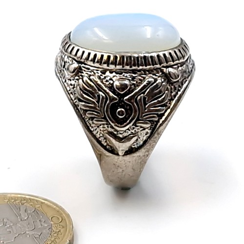 193 - A vintage College style moonstone silver mounted ring. Size - T. Weight - 9.4 grams. Boxed.