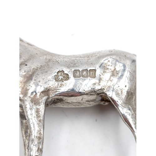 515 - Star Lot : A solid  Irish silver horse figure with hallmarks for Dublin. Dating to 1979 and made by ... 