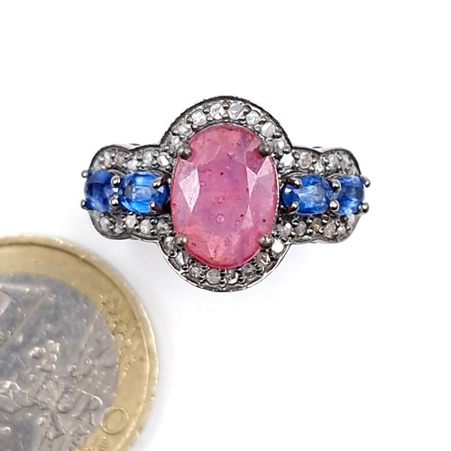 559 - Star lot : A most unusual 3.35ct ruby ring with .80ct kyanite stones and .40ct diamond, set in sterl... 