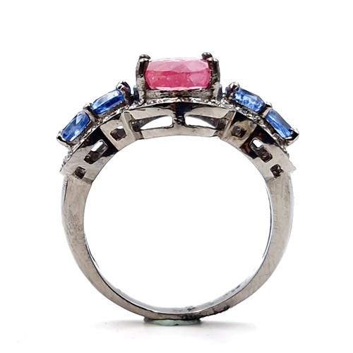 559 - Star lot : A most unusual 3.35ct ruby ring with .80ct kyanite stones and .40ct diamond, set in sterl... 