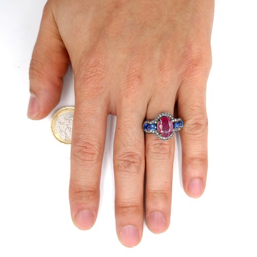 559 - Star lot : A most unusual 3.35ct ruby ring with .80ct kyanite stones and .40ct diamond, set in sterl... 