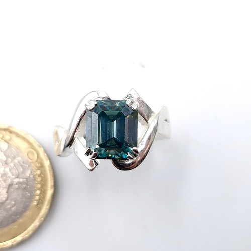 576 - A gorgeous 3ct emerald cut ocean blue moissanite stone ring set in sterling silver stamped 925. Ring... 