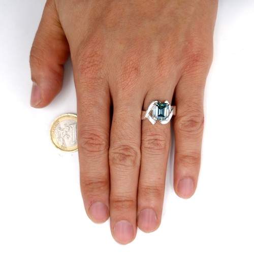 576 - A gorgeous 3ct emerald cut ocean blue moissanite stone ring set in sterling silver stamped 925. Ring... 